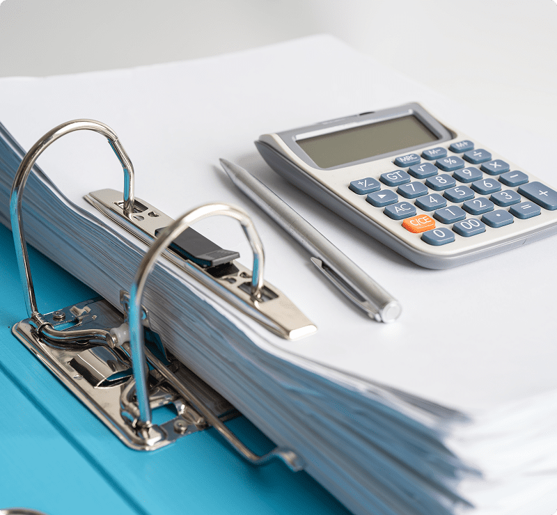 A binder with some papers and a calculator